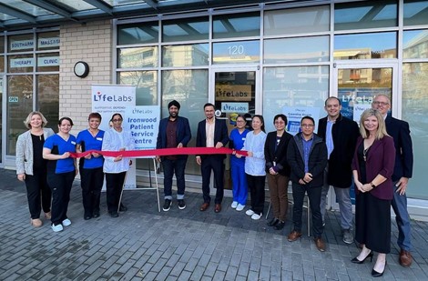 MLA Aman Singh (Richmond-Queensborough), Kyle Nguyen from Pacific Autism Family Network, Thomas Marshall, Vice President, Partnerships and Contracts BC LifeLabs, and LifeLabs employees cut the ribbon at the grand opening of Ironwood Patient Service Centre